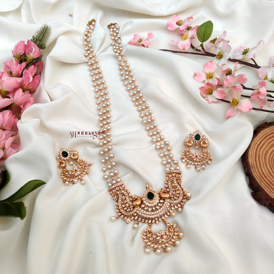 Gorgeously crafted Peacock Design Beaded Haram with white beads