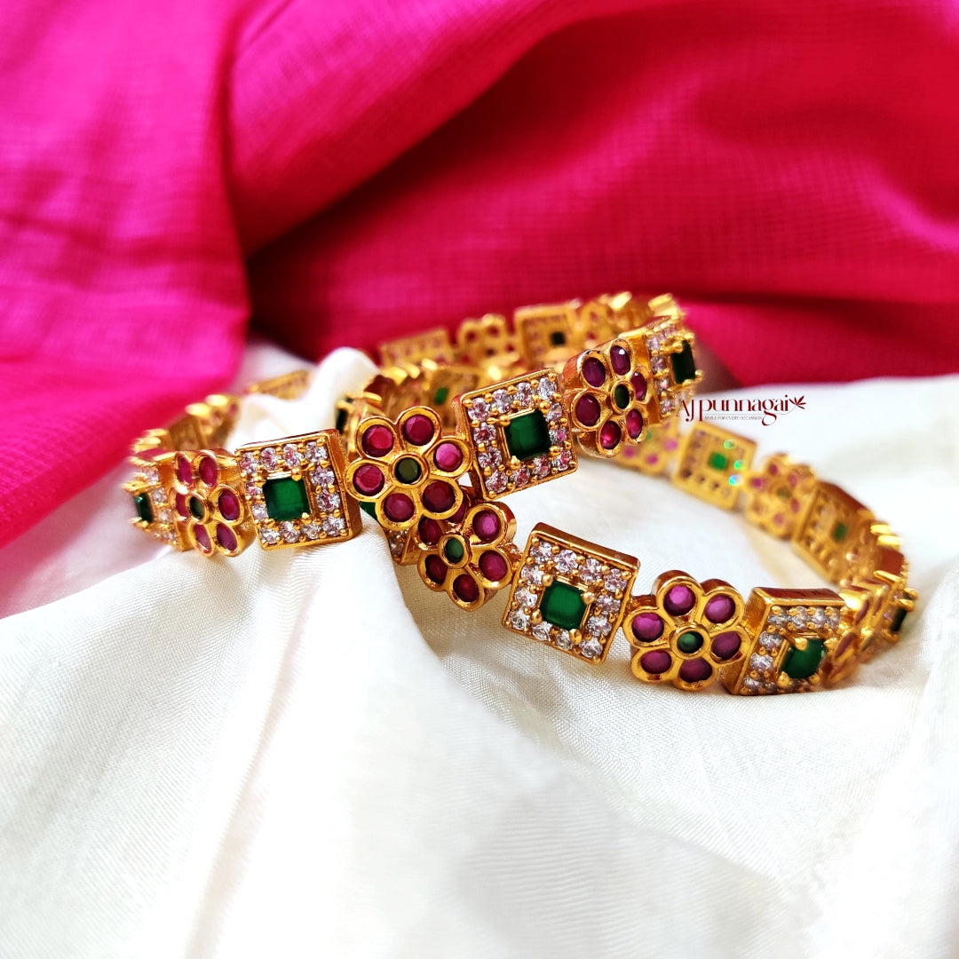 Trendy Kemp and white stone bangles